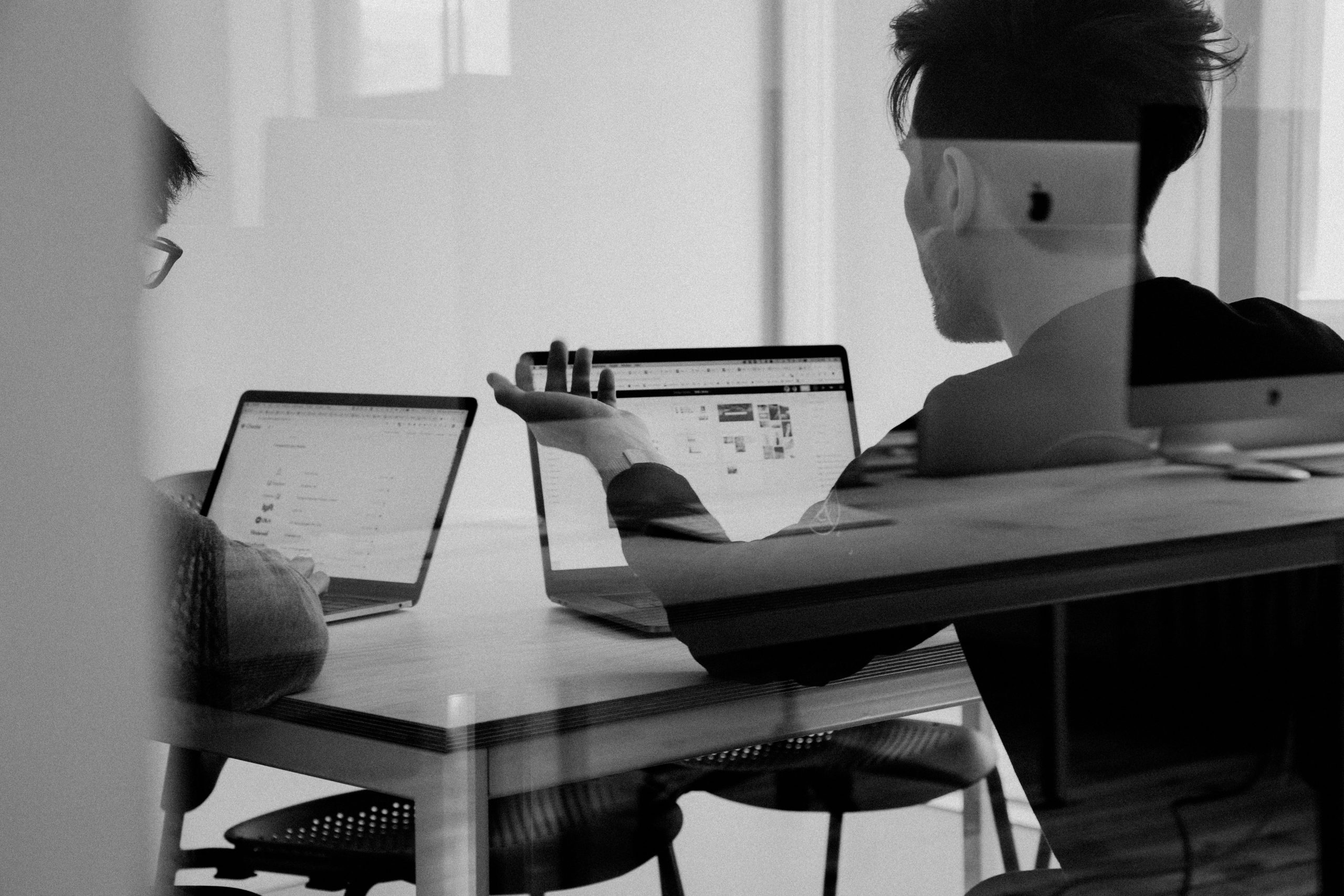 CIO discussing work with colleague